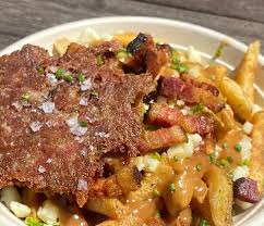 Duckfat signature dishes Duck PoutineOvernight Duck PaniniDuck Confit Panini